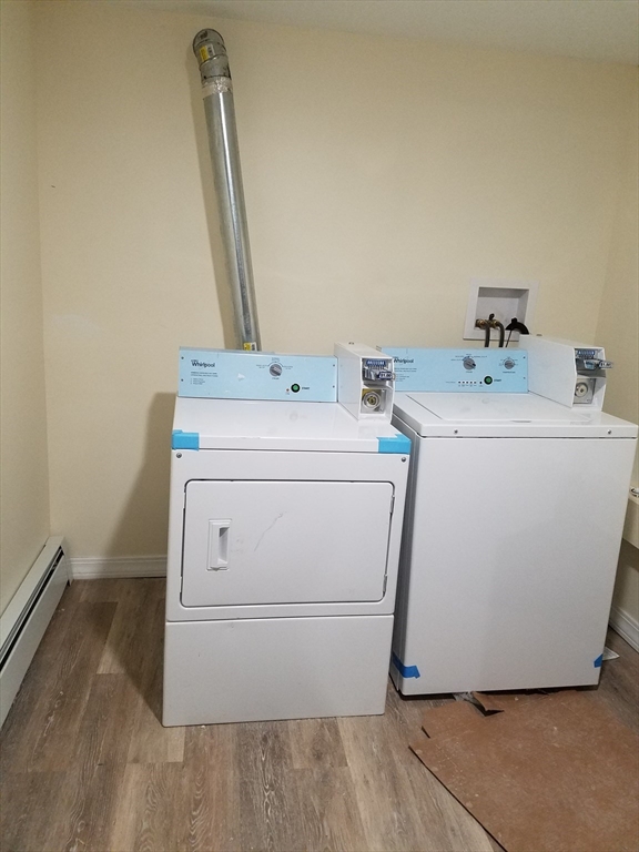 98 Topliff Street, Unit 2 Boston, MA 02122 - Photo 9 of 11 a utility room with dryer and washer