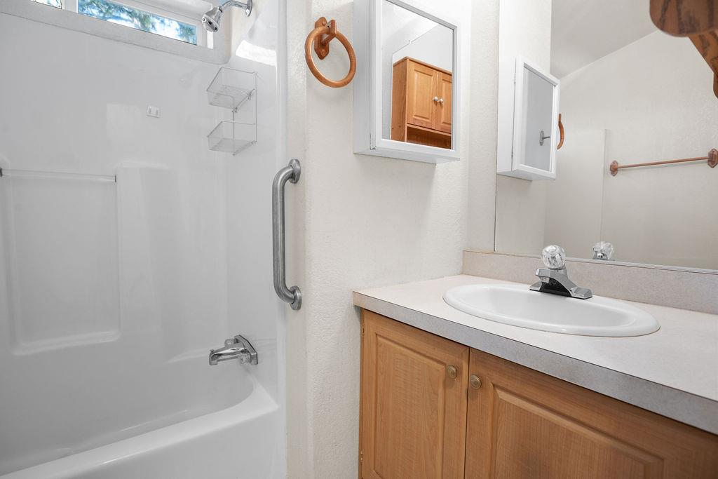 1281 Pleasant Valley Road, Unit 44 Diamond Springs, CA 95619 - Photo 14 of 27 a bathroom with a sink and a bathtub