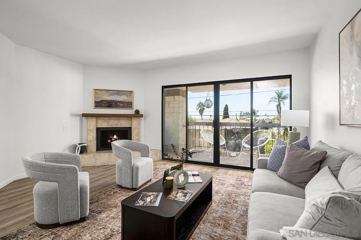3570 1st Avenue, Unit 1 San Diego, CA 92103 - Photo 1 of 55 a living room with furniture and a floor to ceiling window