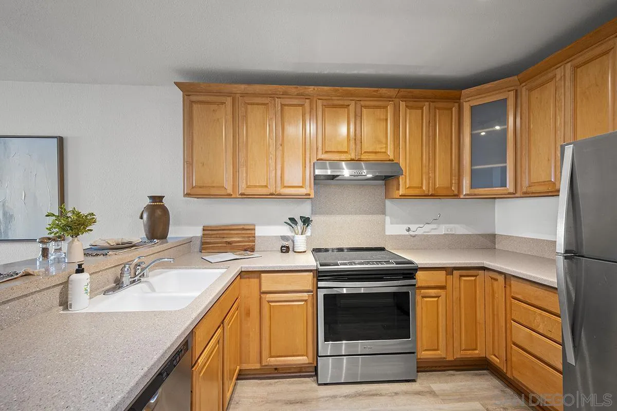 3570 1st Avenue, Unit 1 San Diego, CA 92103 - Photo 23 of 55 a kitchen with a stove a sink and a refrigerator