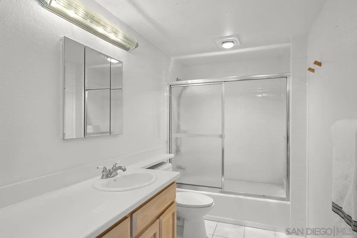 3570 1st Avenue, Unit 1 San Diego, CA 92103 - Photo 26 of 55 a bathroom with a granite countertop sink toilet and shower