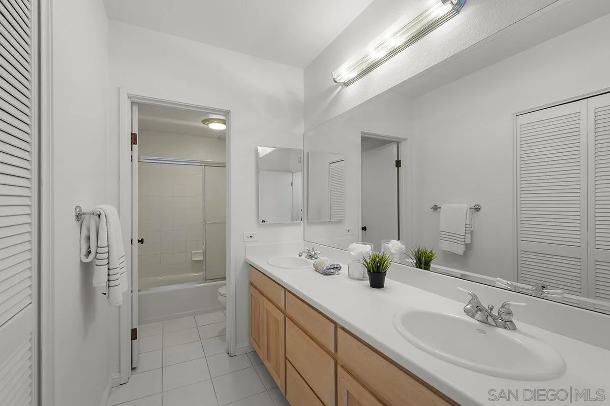 3570 1st Avenue, Unit 1 San Diego, CA 92103 - Photo 31 of 55 a bathroom with a double vanity sink mirror and shower