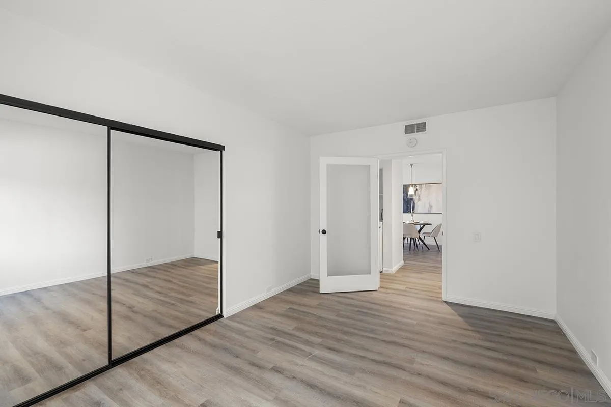 3570 1st Avenue, Unit 1 San Diego, CA 92103 - Photo 34 of 55 a view of an empty room with wooden floor