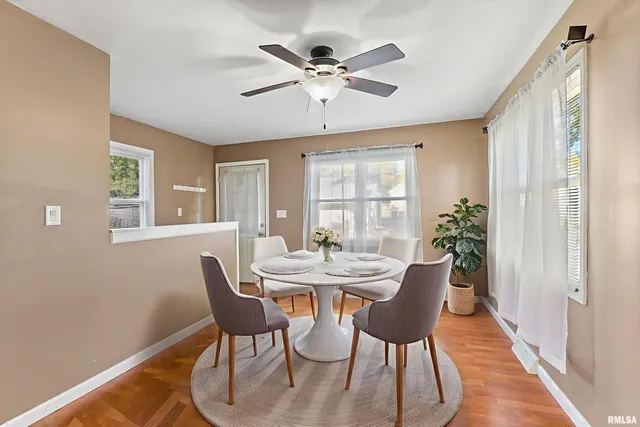 a dining room with furniture and window