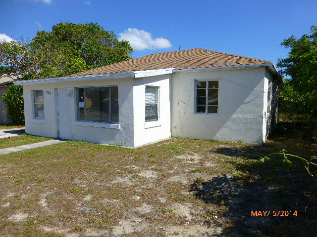 856 West 2nd Street Riviera Beach, FL 33404 - Photo 22 of 22 a view of a house with a yard