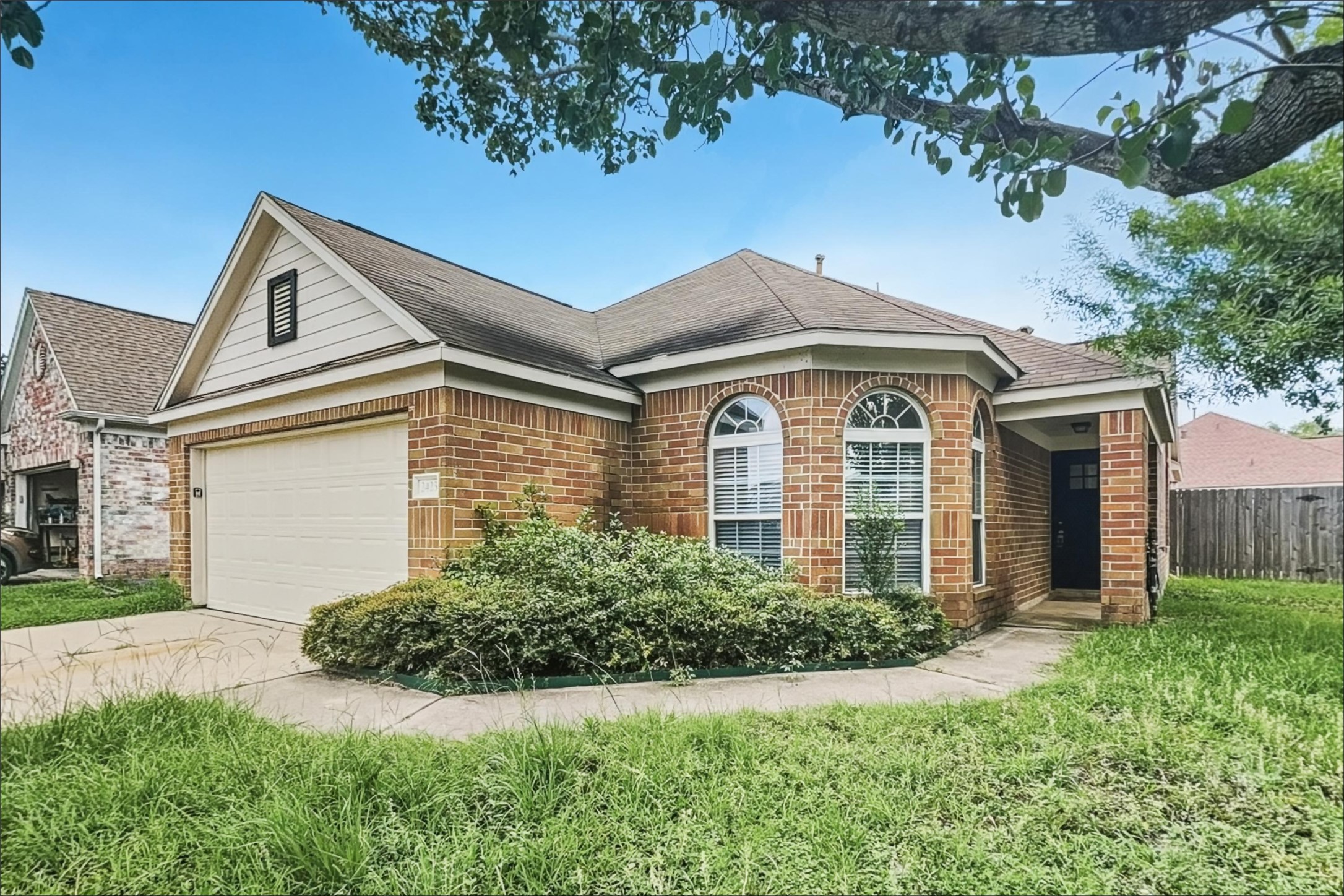 2423 Lofty Falls Court Spring, TX 77386 - Photo 2 of 15 a front view of a house with garden