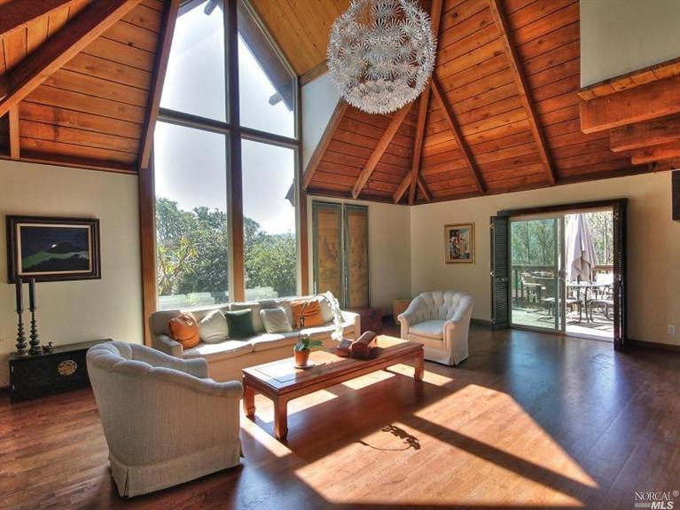 1005 Erica Road Mill Valley, CA 94941 - Photo 1 of 1 a living room with furniture a wooden floor and next to a window