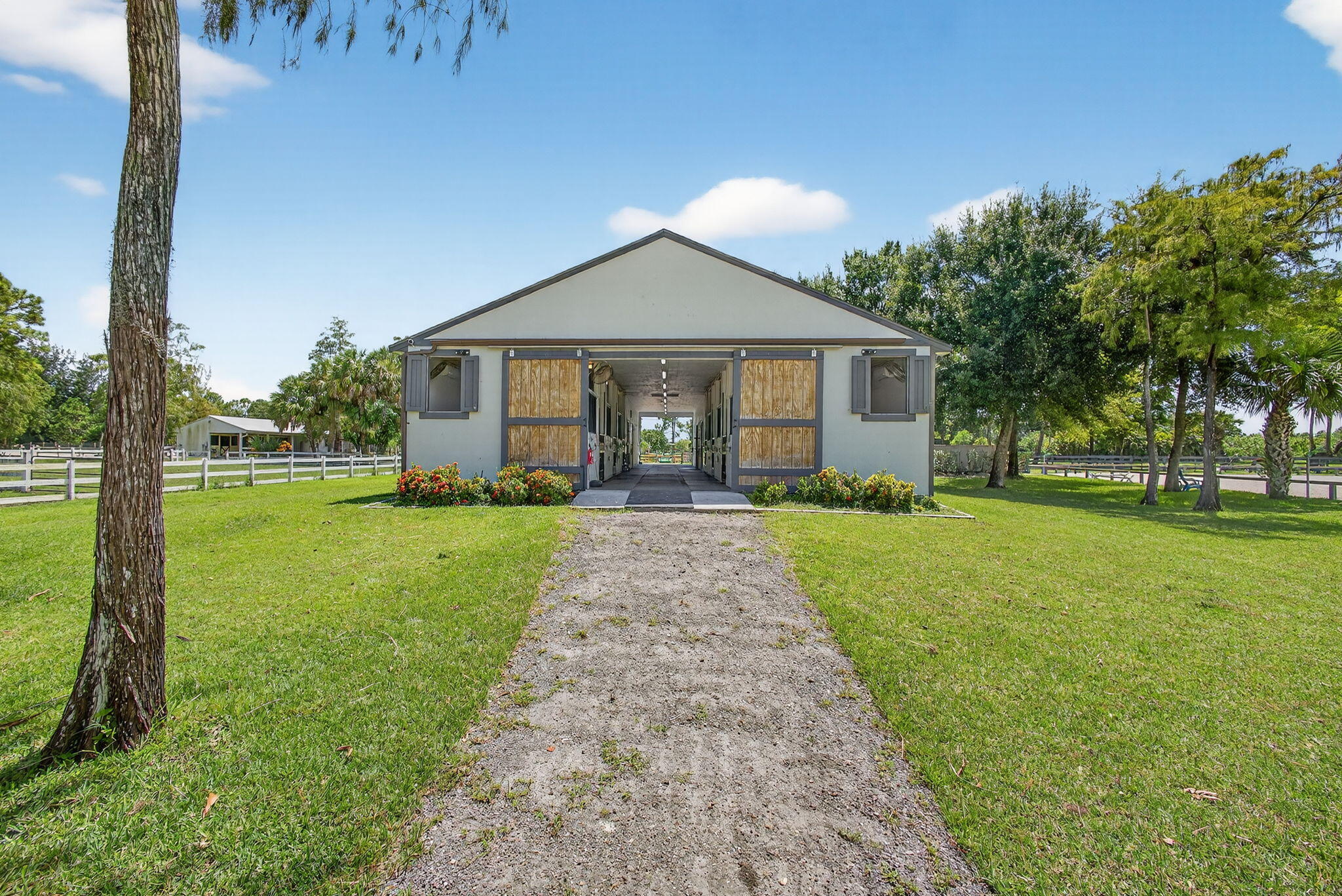 17218 Shetland Lane, Unit 2 STALLS Loxahatchee, FL 33470 - Photo 12 of 54 a front view of a house with yard