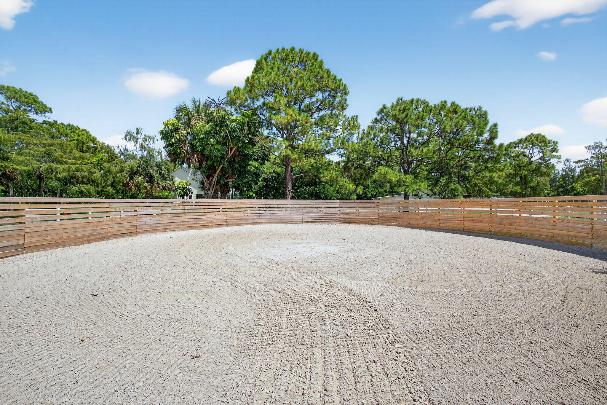 17218 Shetland Lane, Unit 2 STALLS Loxahatchee, FL 33470 - Photo 15 of 54 a view of a big room with trees and plants