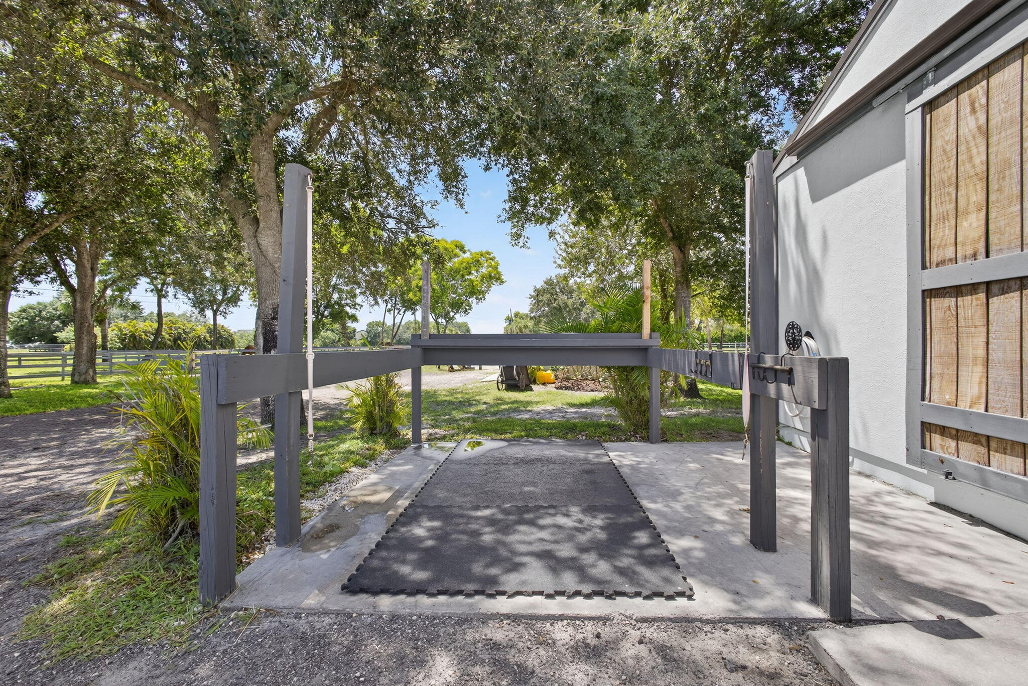 17218 Shetland Lane, Unit 2 STALLS Loxahatchee, FL 33470 - Photo 20 of 54 a view of a yard with wooden fence