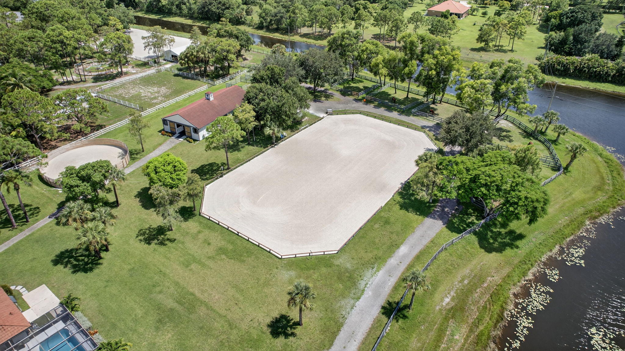 17218 Shetland Lane, Unit 2 STALLS Loxahatchee, FL 33470 - Photo 2 of 54 an aerial view of a residential houses with outdoor space and trees