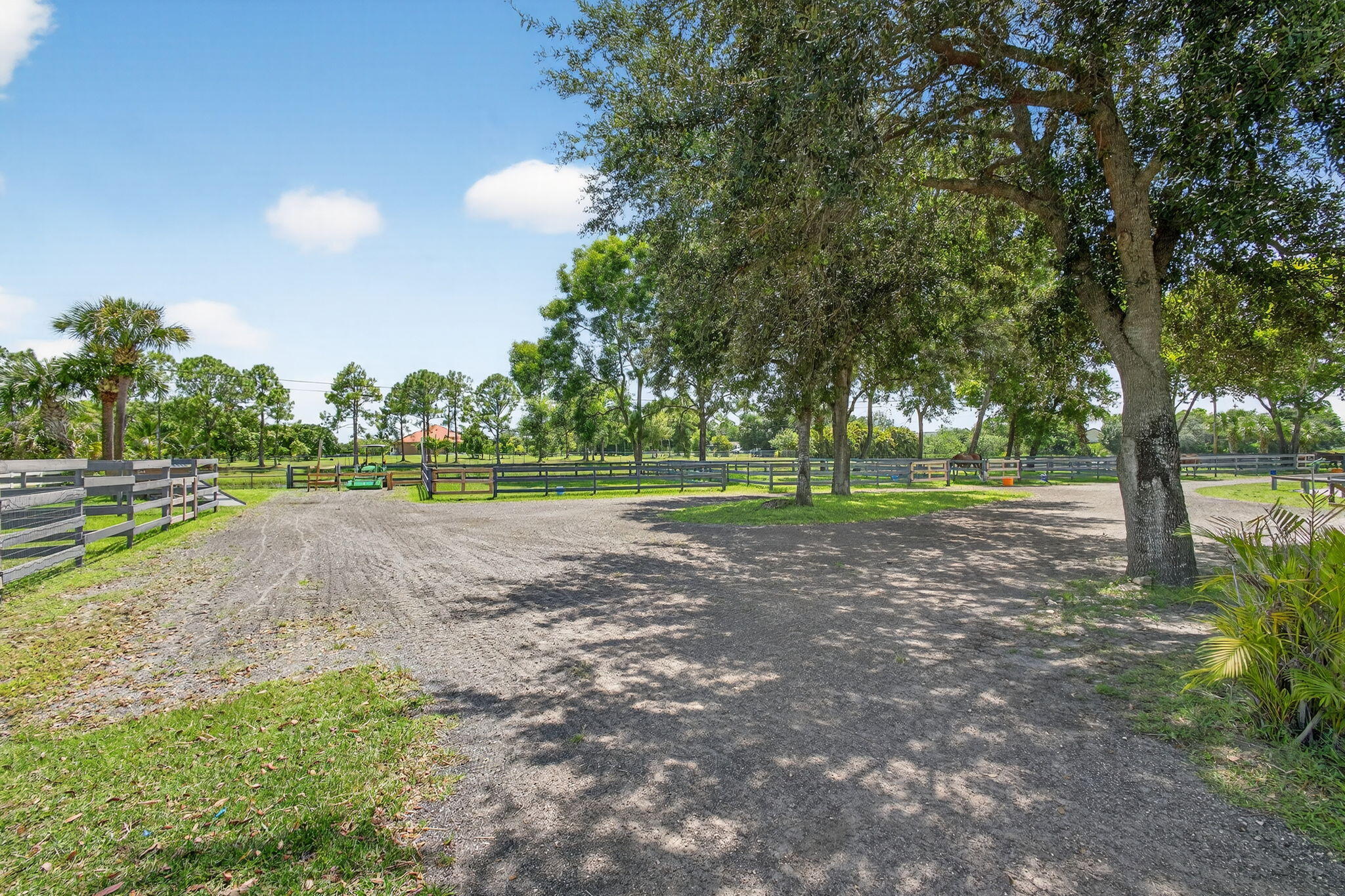 17218 Shetland Lane, Unit 2 STALLS Loxahatchee, FL 33470 - Photo 23 of 54 a view of outdoor space with green field and trees
