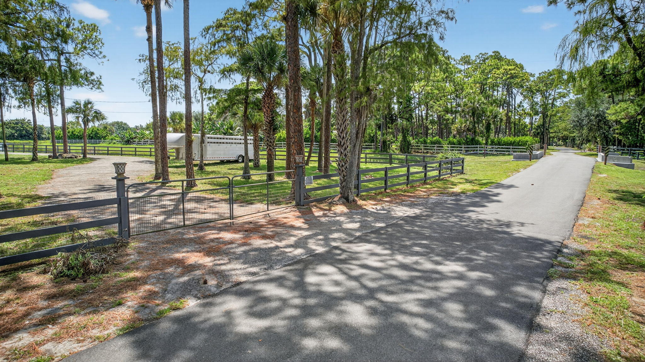 17218 Shetland Lane, Unit 2 STALLS Loxahatchee, FL 33470 - Photo 32 of 54 a view of a park with large trees