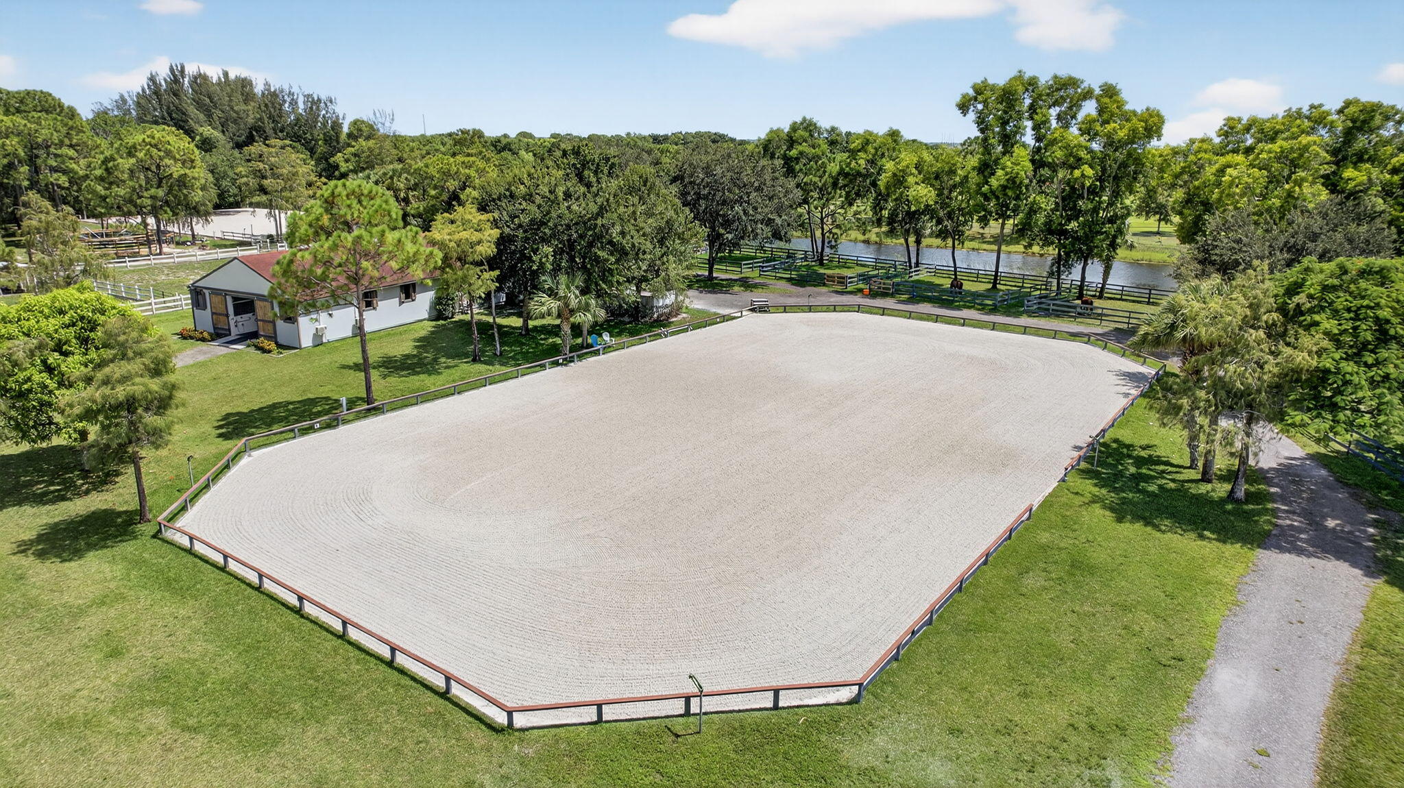 17218 Shetland Lane, Unit 2 STALLS Loxahatchee, FL 33470 - Photo 40 of 54 a view of a backyard with a garden