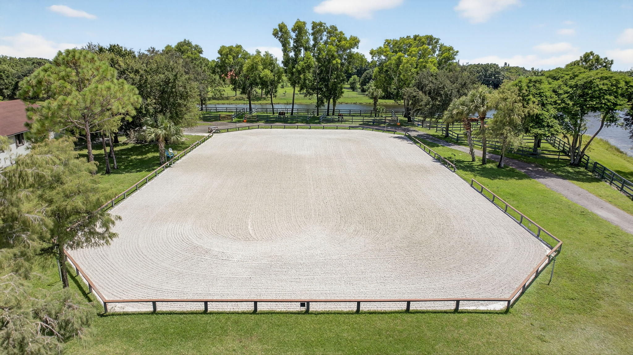 17218 Shetland Lane, Unit 2 STALLS Loxahatchee, FL 33470 - Photo 41 of 54 a white house with lots of green space