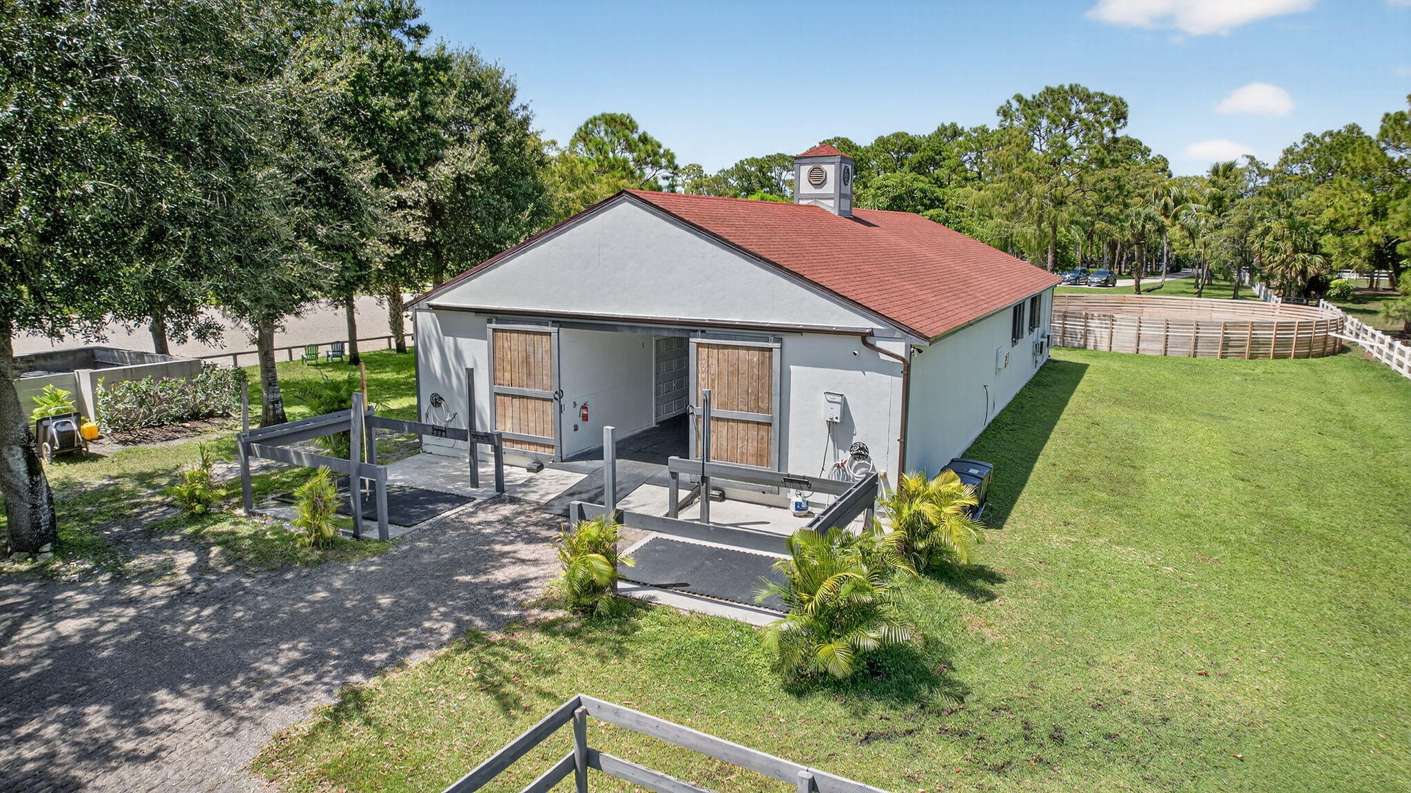 17218 Shetland Lane, Unit 2 STALLS Loxahatchee, FL 33470 - Photo 47 of 54 a house view with a garden space