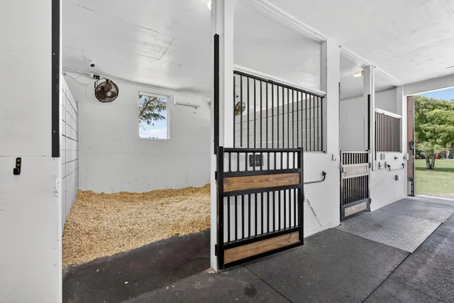 a view of a hallway view with staircase