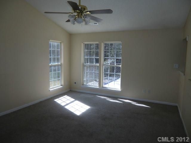 6909 Alanbrook Road Charlotte, NC 28215 - Photo 2 of 14 a view of an empty room with a window