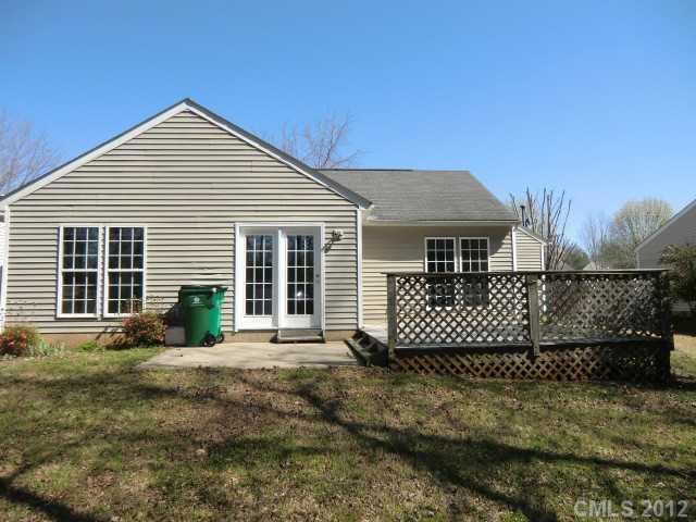 6909 Alanbrook Road Charlotte, NC 28215 - Photo 13 of 14 a front view of a house with a yard