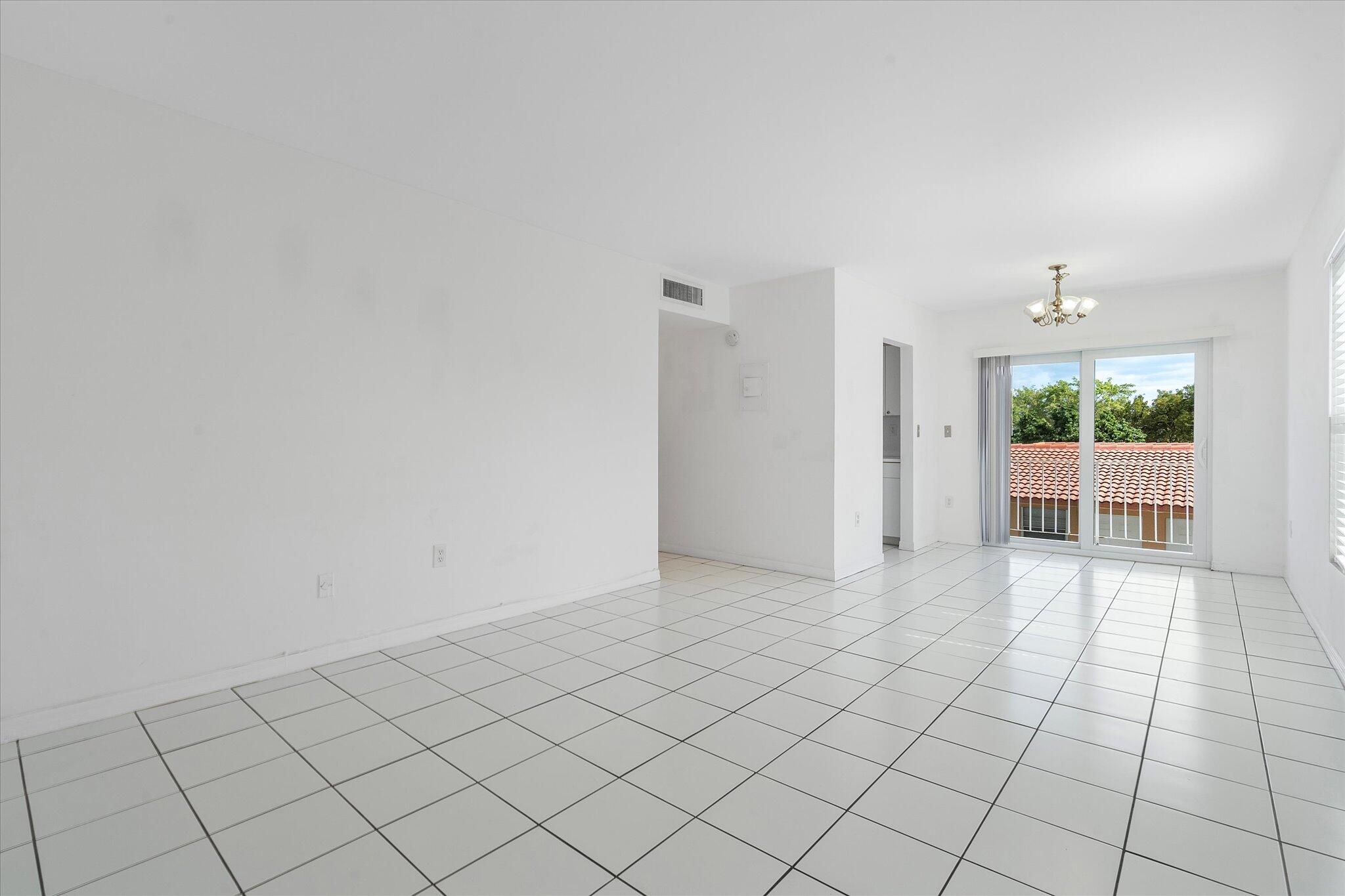 2138 Southwest 6th Street, Unit 301 Miami, FL 33135 - Photo 3 of 15 Family into Dining Room
