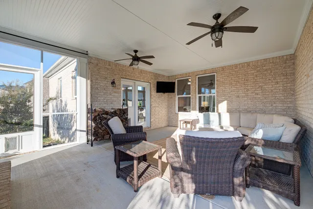 a dining room with furniture window and wooden floor