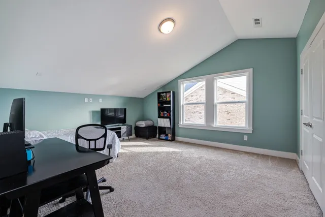a view of a livingroom with furniture and a window