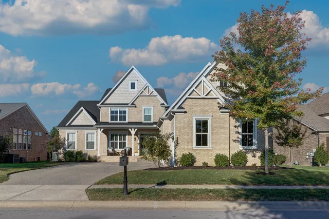a view of house with yard and street view