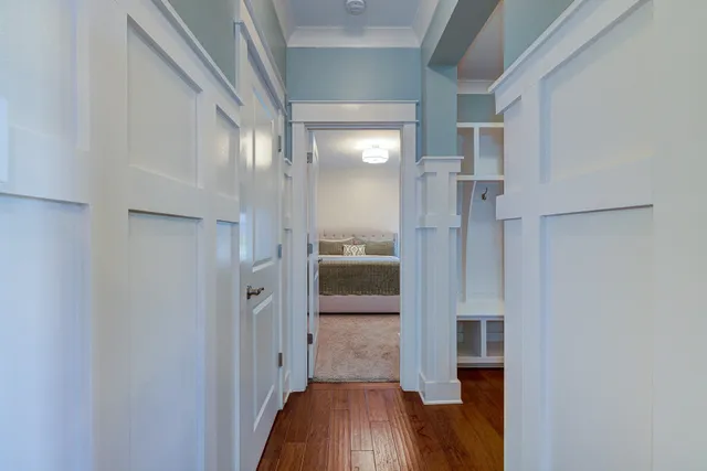 a view of a hallway view with wooden floor and staircase