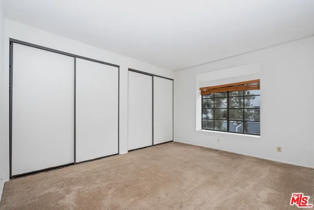 a bathroom with a tub a sink and mirror