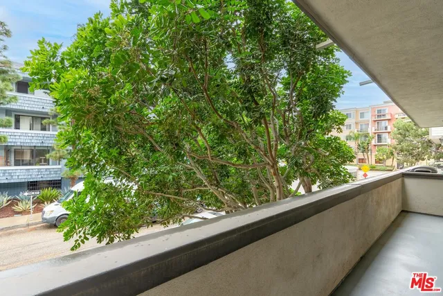 a view of a swimming pool with a table and chairs