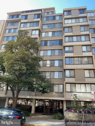 a front view of a building with lot of windows