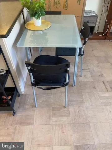 a dining room with a table and chairs