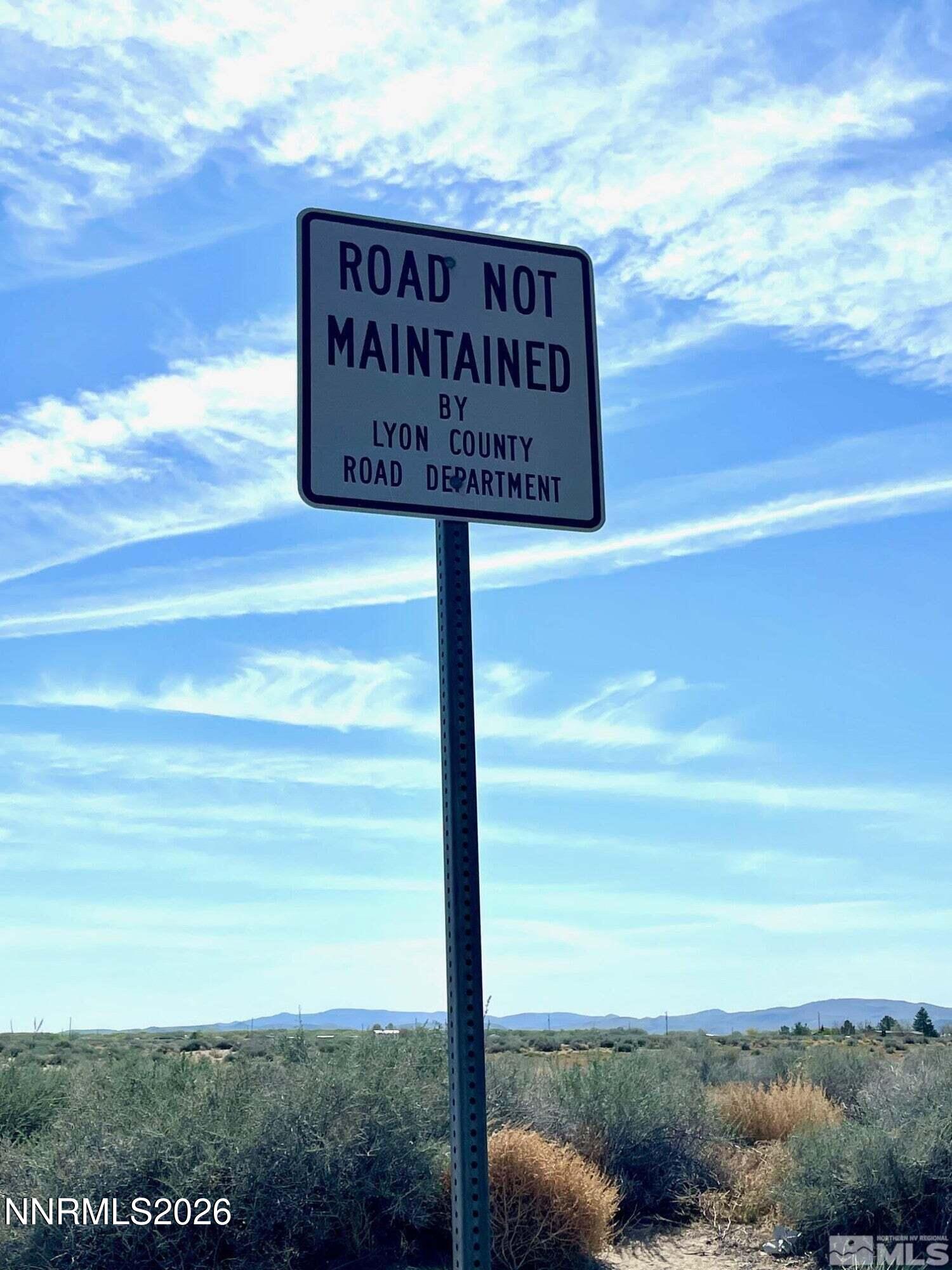 4400 Karyn Street Silver Springs, NV 89429 - Photo 8 of 8 a sign that is on the side of the road