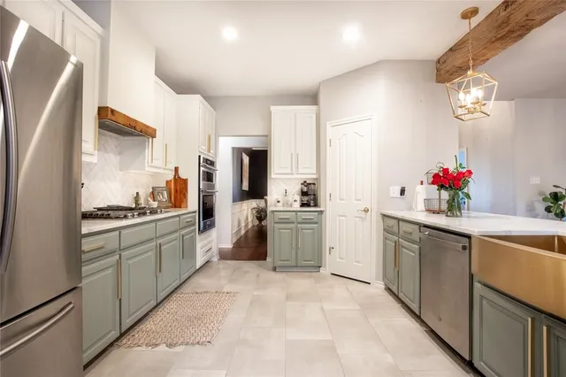 a kitchen with a sink stove and refrigerator