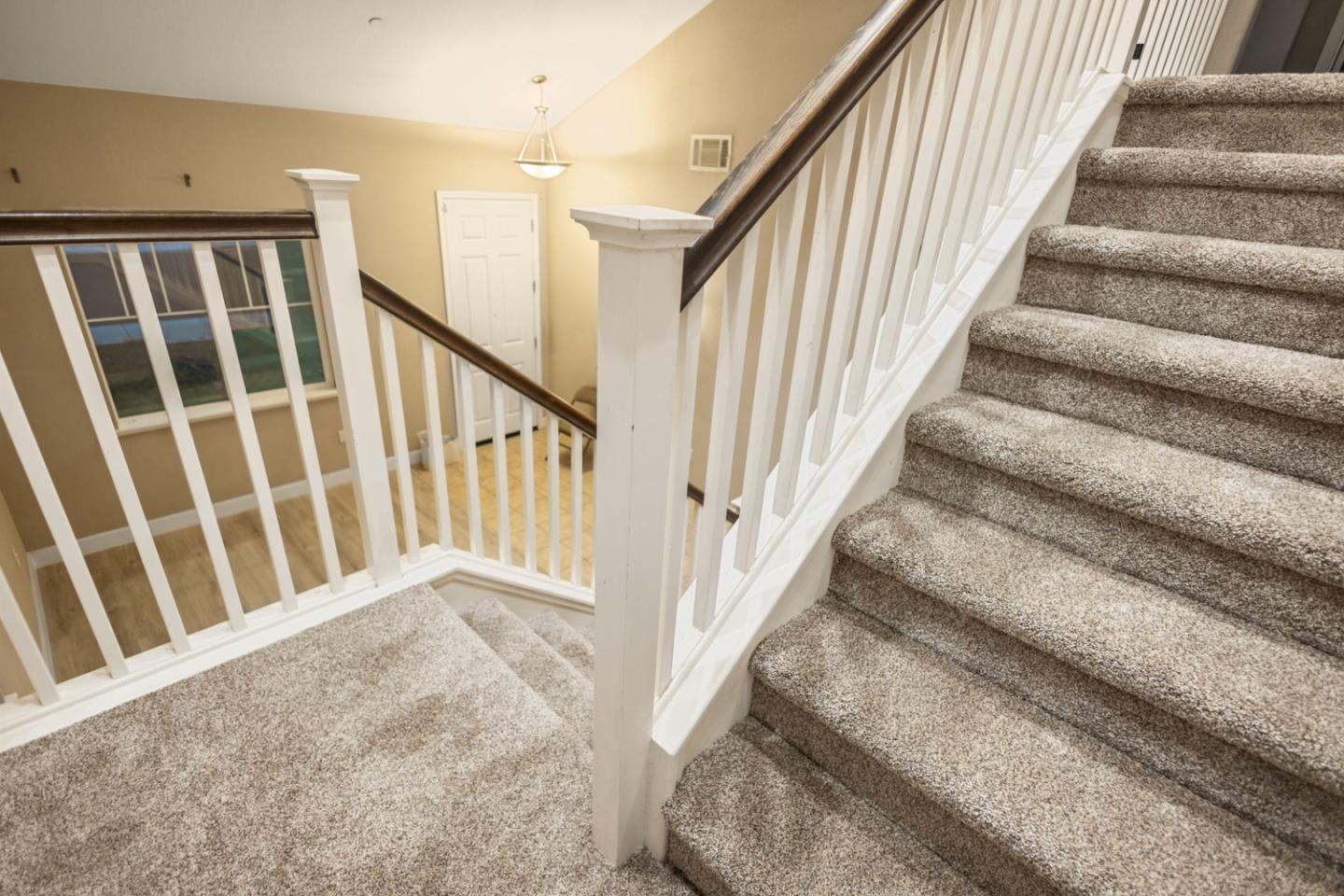 617 Copper Ridge Way Oakley, CA 94561 - Photo 14 of 27 a view of staircase with lots of frames on wall