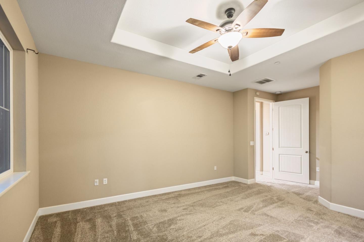 617 Copper Ridge Way Oakley, CA 94561 - Photo 19 of 27 an empty room with windows and fan
