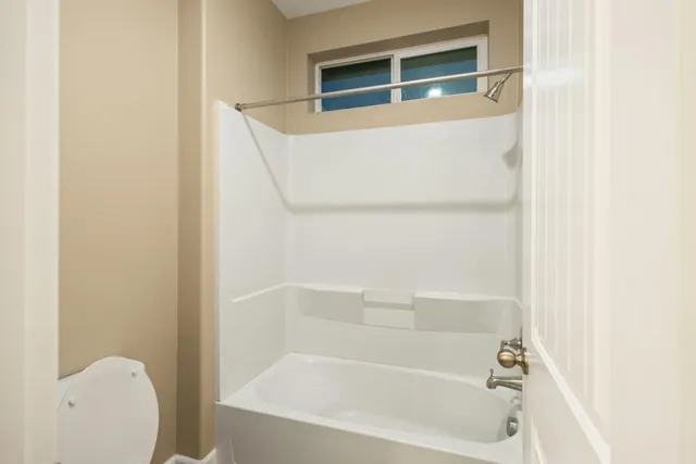 a close up of a bathtub in a bathroom