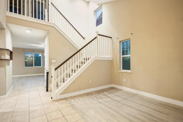 a view of an entryway with wooden floor
