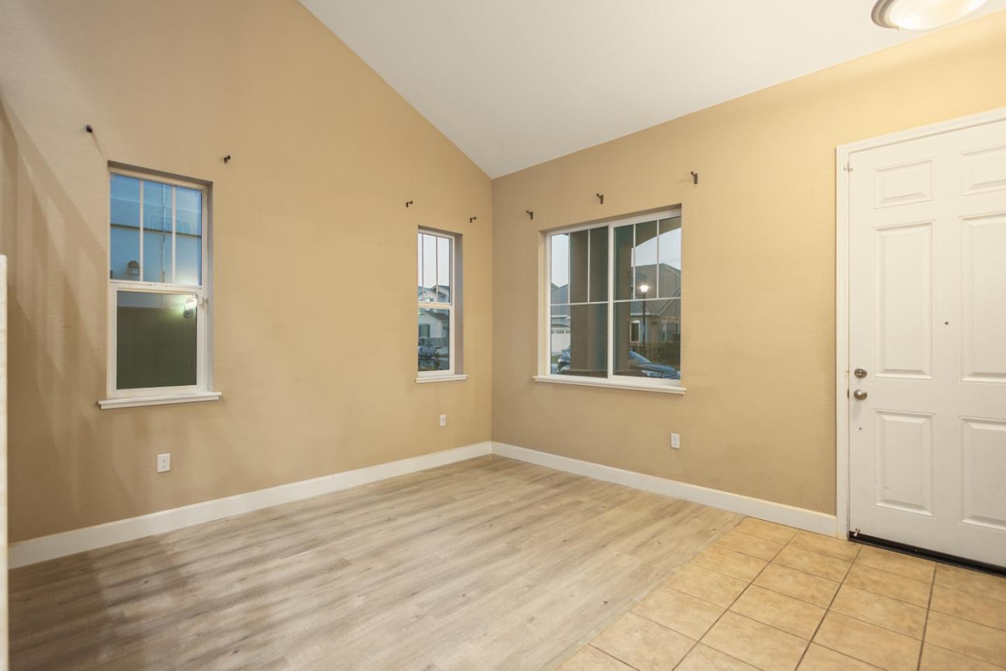 617 Copper Ridge Way Oakley, CA 94561 - Photo 5 of 27 a view of an empty room with wooden floor and a window