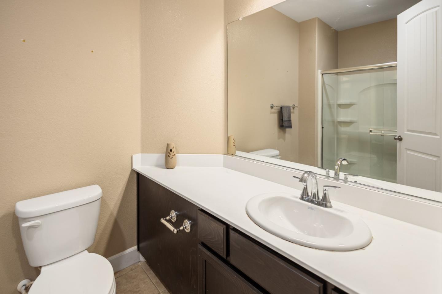 617 Copper Ridge Way Oakley, CA 94561 - Photo 7 of 27 a bathroom with a toilet sink and mirror