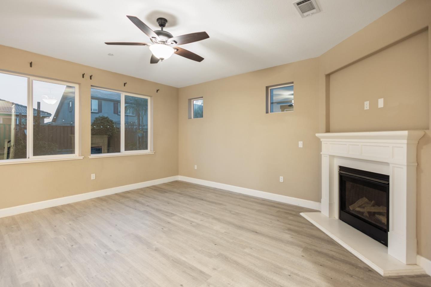 617 Copper Ridge Way Oakley, CA 94561 - Photo 8 of 27 a view of an empty room with a fireplace and a window