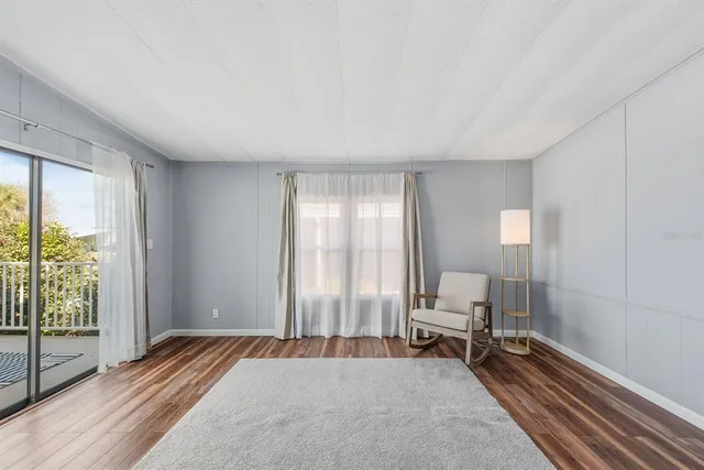 a bedroom with furniture and a window