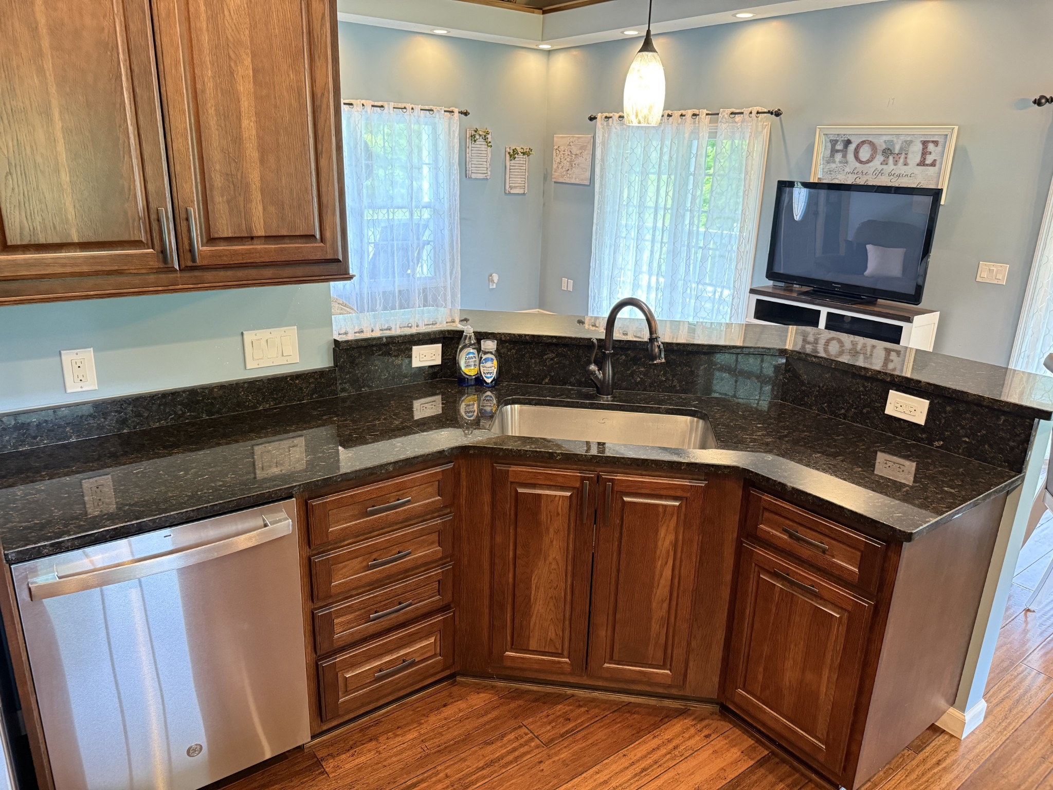 581 Shady Grove Road Bloomington Springs, TN 38545 - Photo 3 of 42 a kitchen with stainless steel appliances granite countertop a sink stove and cabinets