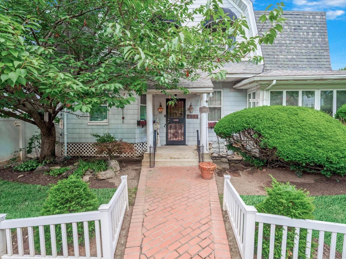 89-44 98th Street Queens, NY 11421 - Photo 1 of 1 a front view of house with yard and green space
