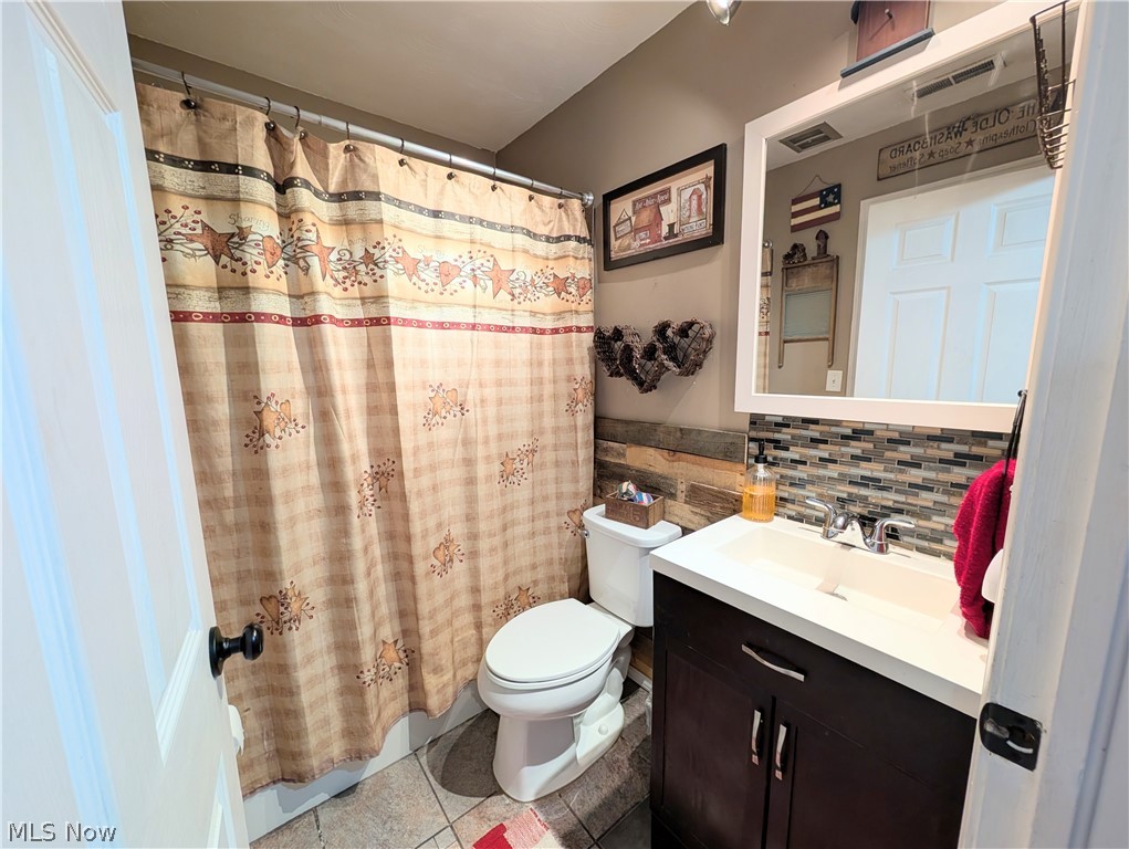 6700 McCaslin Road Nashport, OH 43830 - Photo 25 of 30 Bathroom featuring a dark wood-finish vanity with a white rectangular sink and chrome faucet