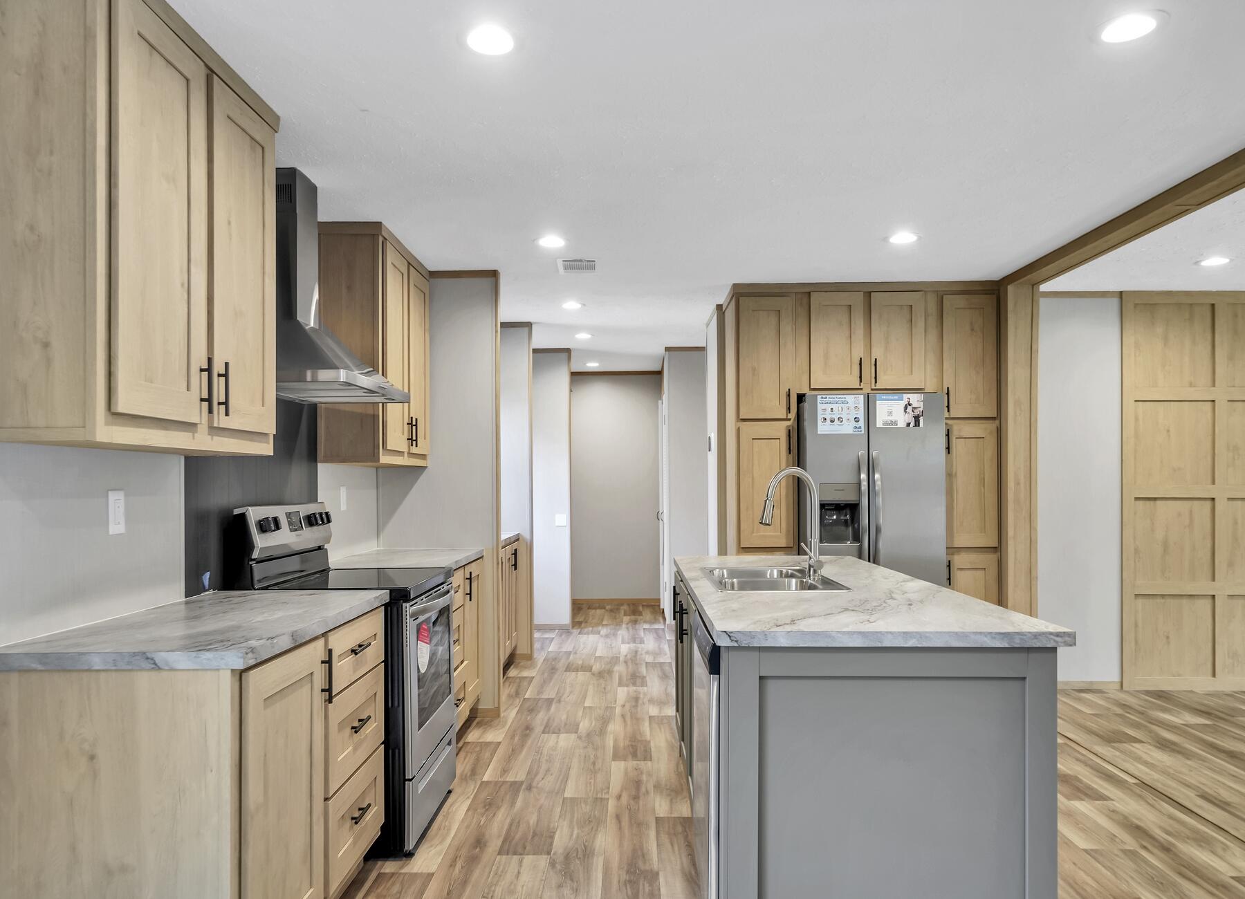 19 South Sally Jean Road DeFuniak Springs, FL 32433 - Photo 8 of 26 a kitchen with stainless steel appliances kitchen island granite countertop a sink refrigerator and cabinets