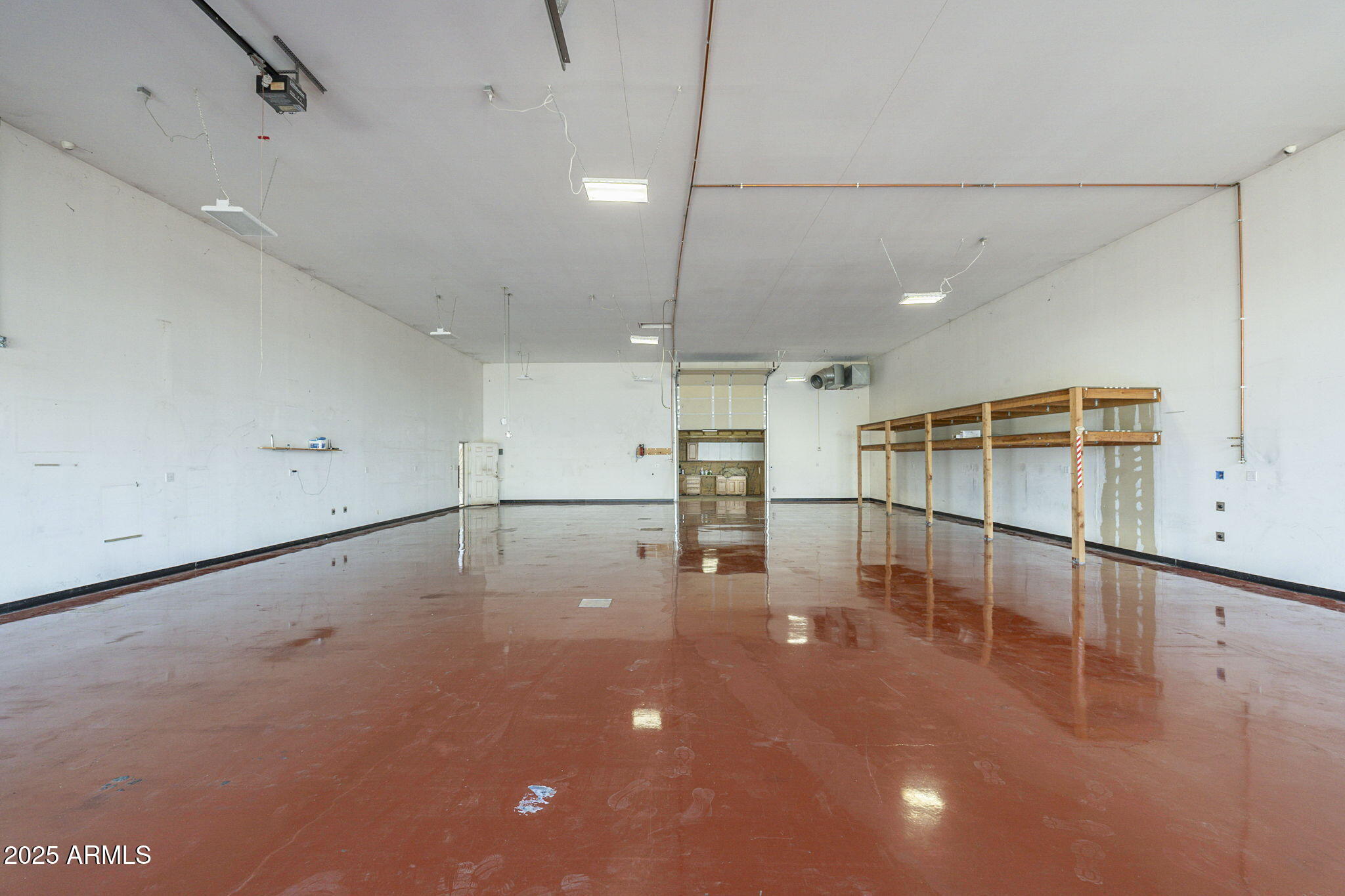 1373 East 23rd Avenue Apache Junction, AZ 85119 - Photo 19 of 53 an empty room with wooden floor and windows