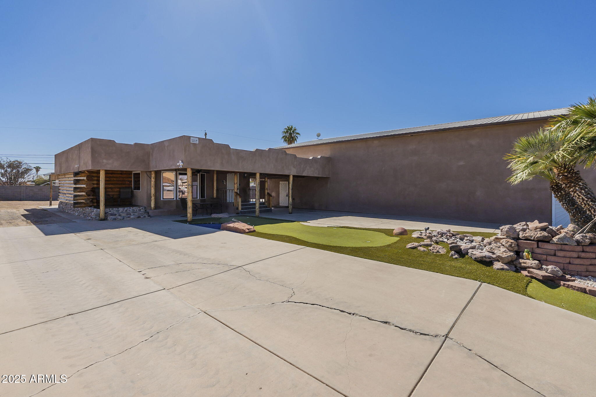 1373 East 23rd Avenue Apache Junction, AZ 85119 - Photo 27 of 53 a view of a house with a swimming pool