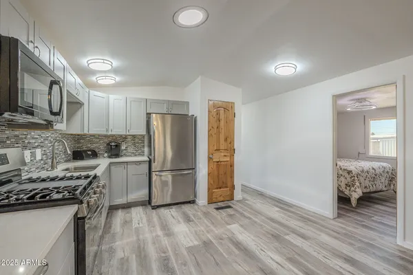 a view of hallway with livingroom and furniture
