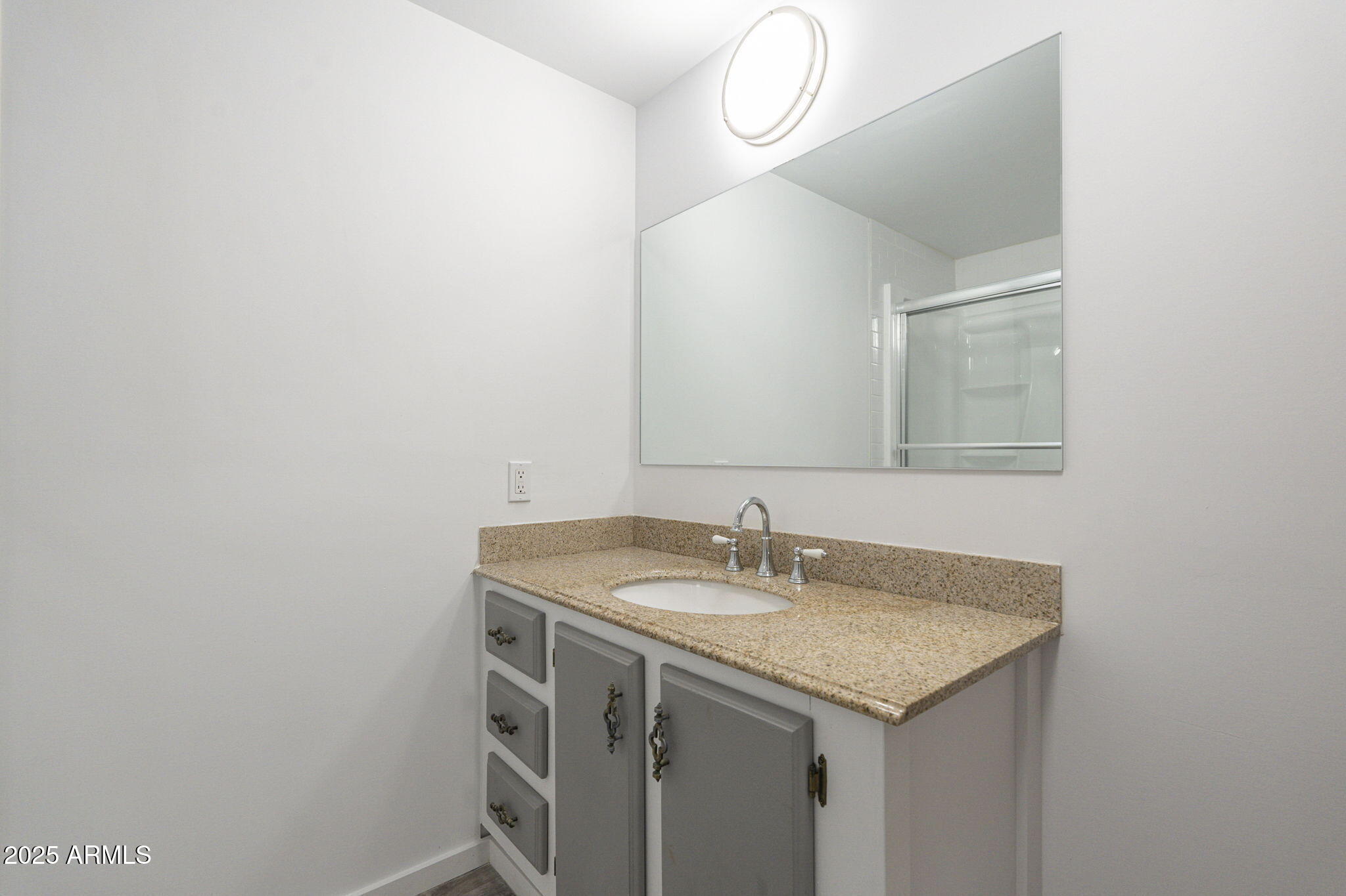 1373 East 23rd Avenue Apache Junction, AZ 85119 - Photo 37 of 53 a bathroom with a sink and a mirror